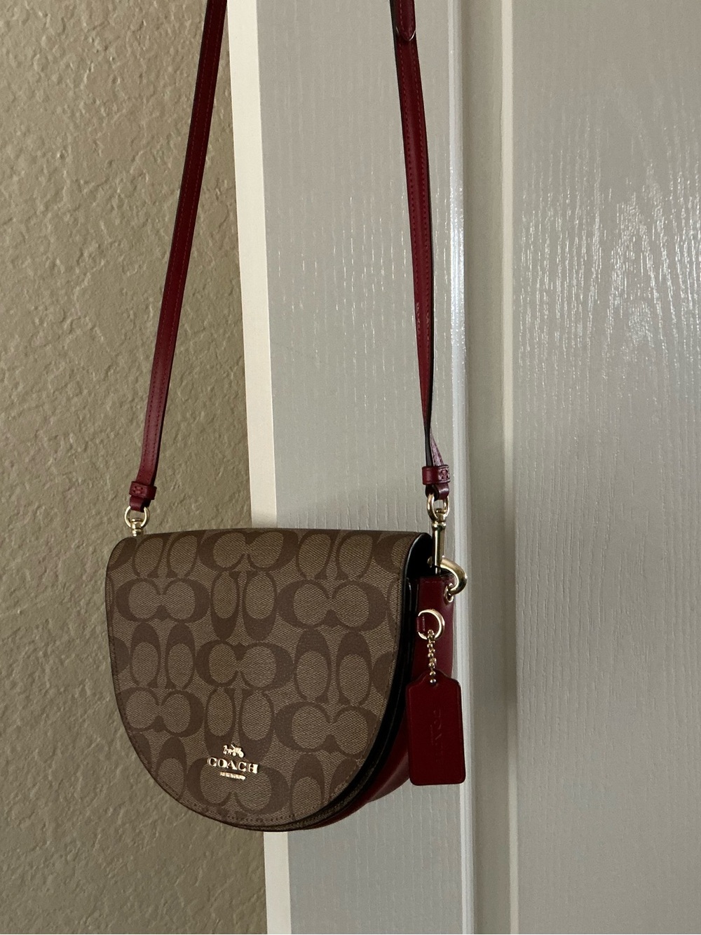 Coach Brown Signature Saddle Crossbody with Red Leather Strap
